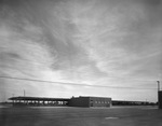 Roadway warehouse with loading docks by Squire Haskins Photography Inc.