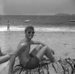 Vacationers relaxing on a beach by Squire Haskins Photography Inc.