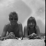 Vacationers relaxing on a beach by Squire Haskins Photography Inc.