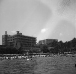 Vacationers relaxing on a beach by Squire Haskins Photography Inc.