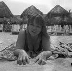 Vacationers relaxing on a beach by Squire Haskins Photography Inc.