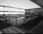 Apartment building, interior courtyard and pool by Squire Haskins Photography Inc.