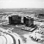 Glass office buildings under construction by Squire Haskins Photography Inc.