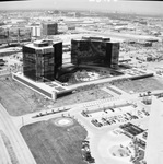 Glass office buildings under construction by Squire Haskins Photography Inc.