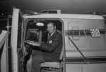 Man seated in semi tractor by Squire Haskins Photography Inc.