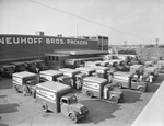 Neuhoff Brothers Packers building with employees and delivery trucks by Squire Haskins Photography Inc.