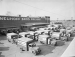 Neuhoff Brothers Packers building with employees and delivery trucks by Squire Haskins Photography Inc.