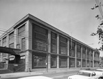 Brick two story factory building by Squire Haskins Photography Inc.