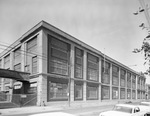 Brick two story factory building by Squire Haskins Photography Inc.