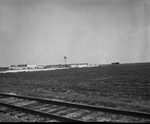 Field, plowed, with Chrysler Boat in the distance by Squire Haskins Photography Inc.