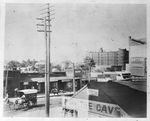 Downtown Dallas street scene with horse-drawn buggies on street and telephone pole, with the Oriental Hotel in background at Commerce at Akard by Squire Haskins Photography Inc.