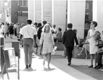 Downtown Dallas, Texas crowds on sidewalk in front of bank parking garage by Squire Haskins Photography Inc.