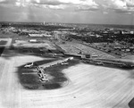 Aerial of Love Field, its terminal and runway, looking south toward downtown Dallas, Texas by Squire Haskins Photography Inc.