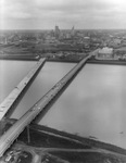 Two bridges over flooded Trinity River into downtown Dallas by Squire Haskins Photography Inc.