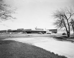 Shopping center with a Buddies grocery store by Squire Haskins Photography Inc.