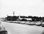 First Covenant Church exterior with cars lining the road in front by Squire Haskins Photography Inc.