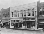 Fort Worth street scene and businesses - Lederman Cigars, Quality Inn, Worth Café