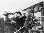 Old Photograph of People Standing Beside an Airplane