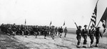 The 36th Infantry Division soldiers march with Honor Guard of World War I