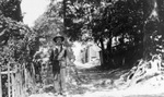 Mike Ryan standing in front of Fort Worth's first well, 1923