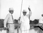 Amon G. Carter and J. L. Lancaster, fishing