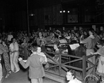 Orchestra and crowd scene at Pioneer Palace during Frontier Centennial