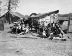 Palestine, Texas, men resting around shack, 1937