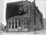 Amon G. Carter standing in front of a bank in Montague, Texas