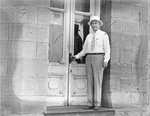 Amon G. Carter standing in front of a bank in Montague, Texas