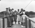 Group fishing on dock at Shady Oak Farm pond