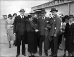Edward F. McGrady, Frances M. Robinson, Edgar Kobak, General Hugh Johnson, and Amon G. Carter at the airport