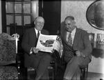 Dr. Raymond Foley and Congressman Sam Rayburn looking over Foley's magazine, "To-Day"
