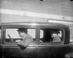 Will Rogers and Amon G. Carter in a car