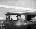 Will Rogers and Amon G. Carter in a car