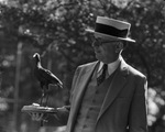E.M. Sones holds mounted English water hen he gave to the Forest Park Zoo