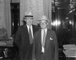 P. M. Bratten (left) of Fort Worth and Colonel J. C. Cone, director of air regulations for the Department of Commerce