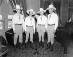 Chuck Wagon Gang sing before a WBAP microphone
