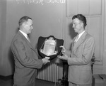 Marvin D. Evans, left, presents President's Trophy in Golf to Jimmy Walkup