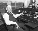 Cecil Coombs, business manager, at his desk at LaGrave Field