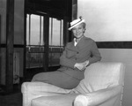 Sally Rand posing for photograph when she arrived in Fort Worth