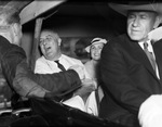 President Franklin Roosevelt and others in car during visit to Fort Worth