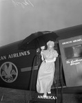 Sally Rand wearing old fashioned costume exits American Airlines plane at Meacham Airfield