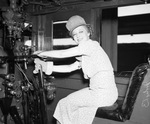 Sally Rand in cabin of steam engine to open "Railroad Week"