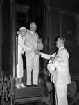 Mr. and Mrs. John Nance Garner bidding farewell to Amon G. Carter after Frontier Centennial