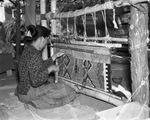 At Fort Worth's Frontier Centennial Navajo Indian art of rug weaving being done by members of a tribe from Arizona