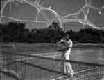 Howard Walsh, Fort Worth tennis star, prepares for the Texas Amateur Athletic Federation tournament