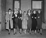 Sally Rand (in fur coat) with group of girls who are in her revue show