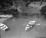 Silver Creek at Lake Worth, unidentified boy and girl in a canoe