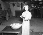 Mrs. Amon G. Carter beside watermelon
