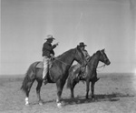 Doc Ellis, foreman, and Bob Dixon, wagon boss, on horseback at Spur Ranch